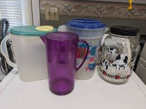 lot 1146 image: (4) Pitchers.