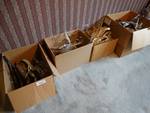 4 boxes of various clothes hangars