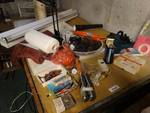 Contents on work bench- extension cords, RC parts, lamp, misc.