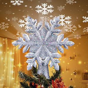 lot 1344 image: Christmas Tree Topper Lighted with Built-in Led Rotating Snowflake Projector Lights, 9.6�� Hollowed Tree Topper with Silver Spangle Retail $25.99