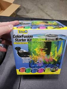 lot 2788 image: Tetra Bubbling LED Aquarium Kit 1 Gallon, Hexagon Shape, With Color-Changing Light Disc,Green (Packaging may vary)