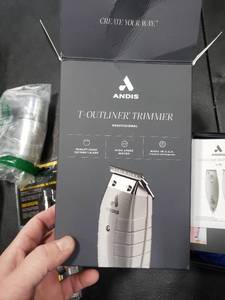 lot 2797 image: Andis 04780 Professional T-Outliner Beard & Hair Trimmer for Men with Carbon Steel T-Blade, Bump Free Technology  Corded Electric Beard Trimmer - Grey