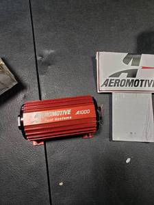lot 2833 image: Aeromotive 11101 Red Fuel Pump (A1000 - EFI or Carbureted Applications) - Retail $447.65