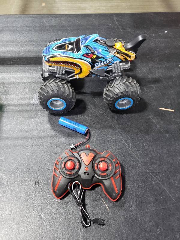 lot 4252 image: BESWIT 116, 2.4 GHz All Terrain Monster Truck, RC Truck 2 Rechargeable Batteries for 80 Mins Play, Spray Remote Control Car for Boys 8-12 and Girls or Adult, MK724A