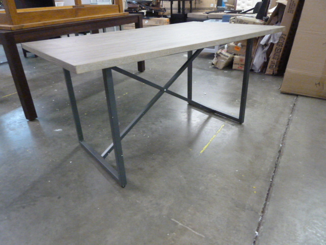 lot 208 image: LARGE WOOD TABLE WITH METAL LEGS - DAMAGED CORNER