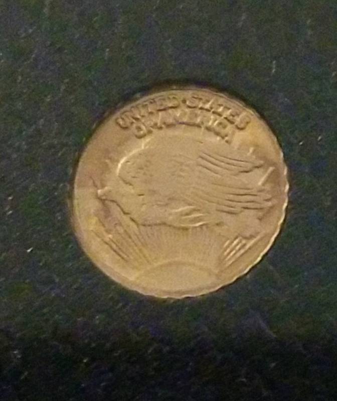 lot 121 image: 10K GOLD MINI COIN ROUND TOKEN EAGLE & LIBERTY DESIGN 9.8mm 0.3 GRAMS
