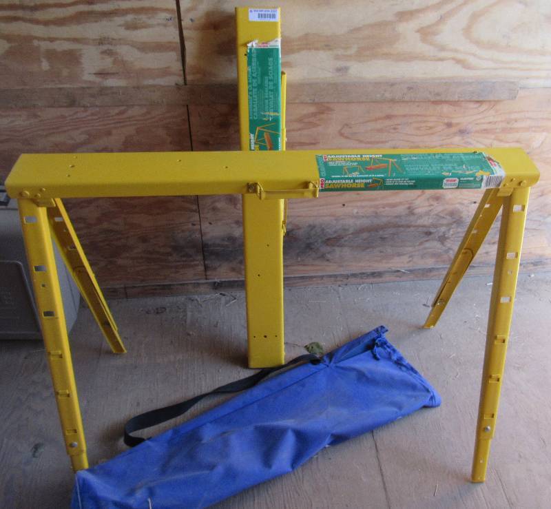 lot 2107 image: Folding Steel Saw Horses - Adjustable Height 25 - 34 - Holds up to 2,400 Lbs per pair With Carrying Bag