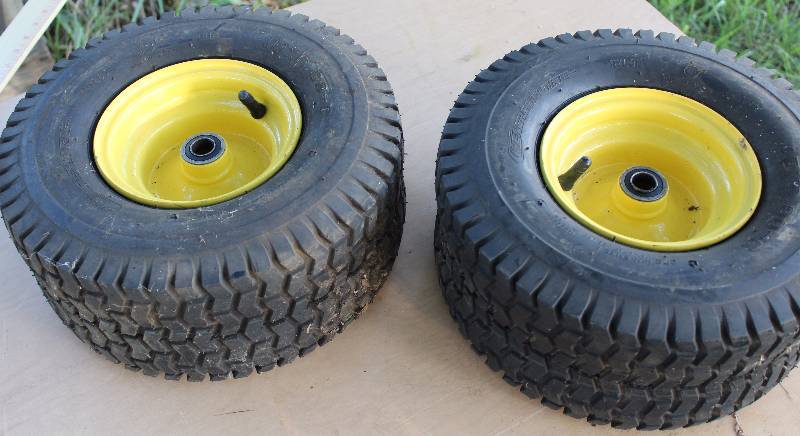 lot 2147 image: Lot of 2 - Mower Tires  Rims - See Photo