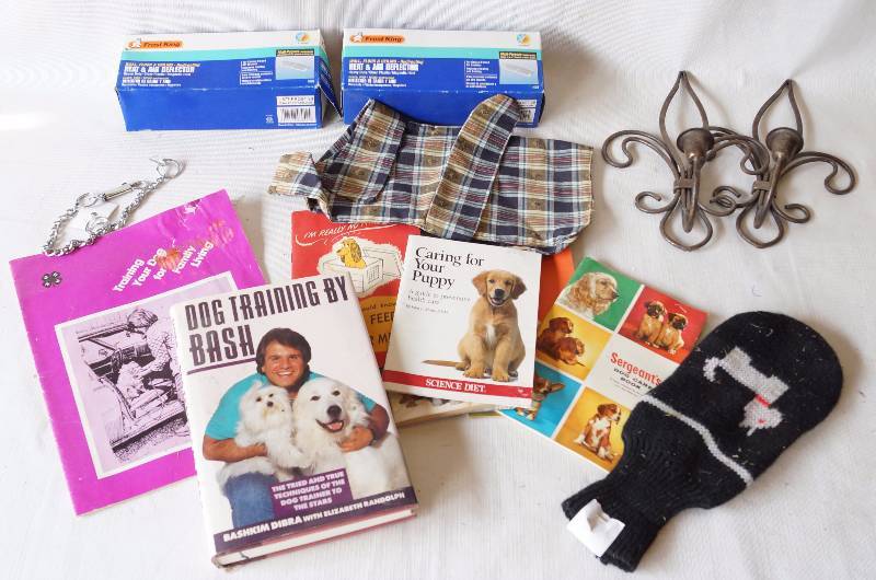 lot 6021 image: Lot of Dog Books, 2 fleur de lis - wall candle holders and 2 Air Vent Re-Directors (New in the Box)