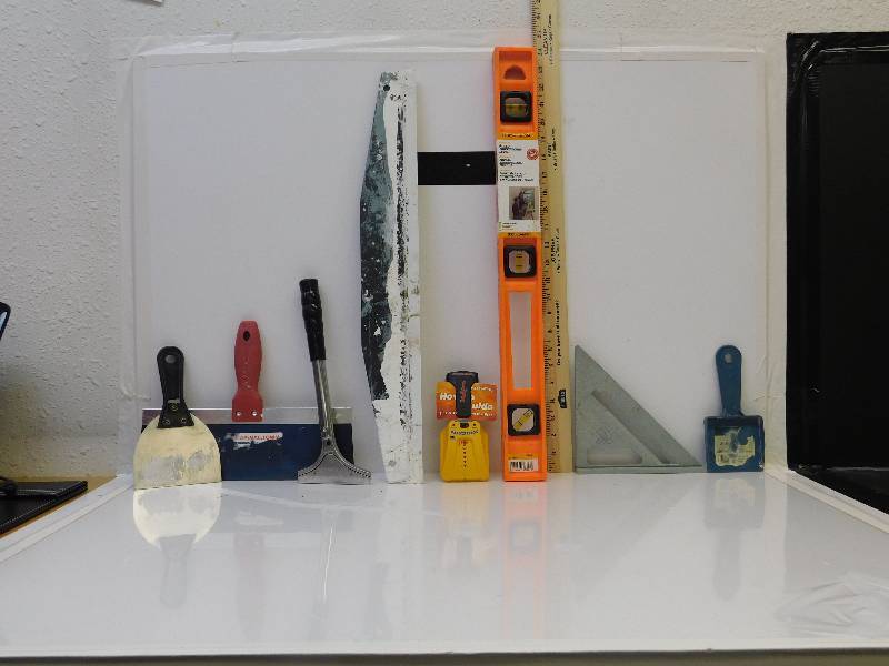 lot 9050 image: Speed Square, Putty Knifes, Level and Stud Finder.