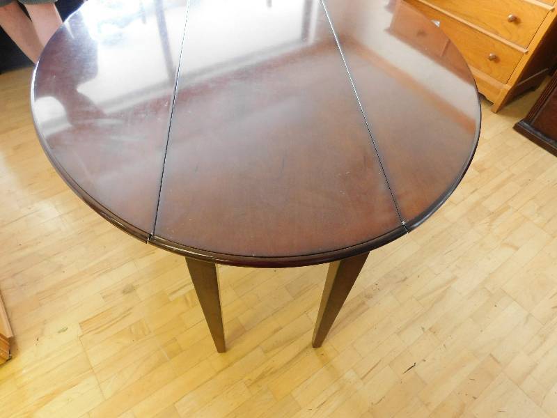lot 9066 image: 60 to 50 Wide Oval Top. 29 Tall. Bombay Brand Double Gateleg Table.