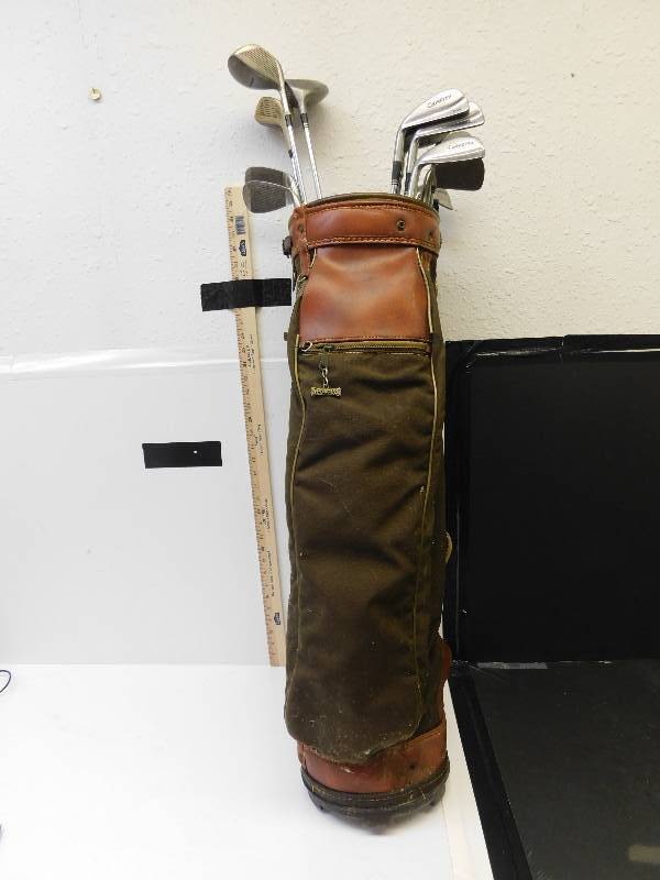 lot 9141 image: 13 Vintage Left Handed Golf Clubs in a Leather Spalding Brand  Golfbag.