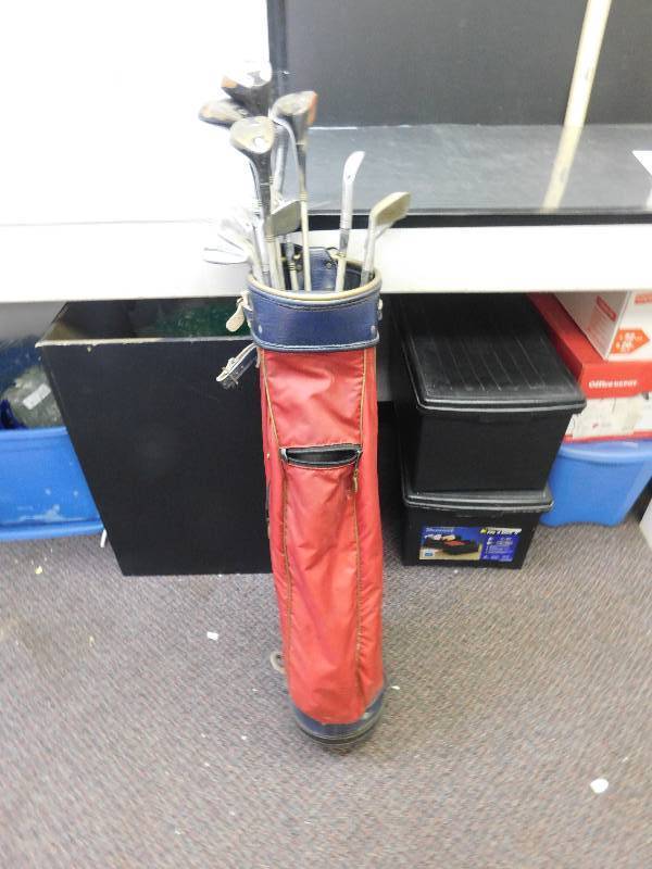 lot 9142 image: 12 Vintage Golf Clubs in a Leather RAM Brand Golfbag.