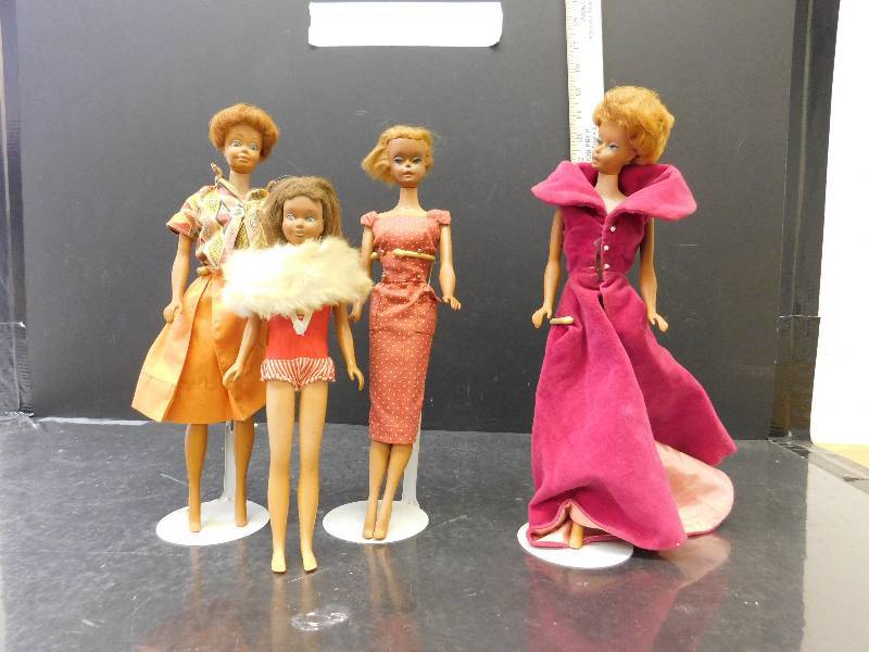 lot 9172 image: Antique and Vintage Assortment of Barbies  Clothes.