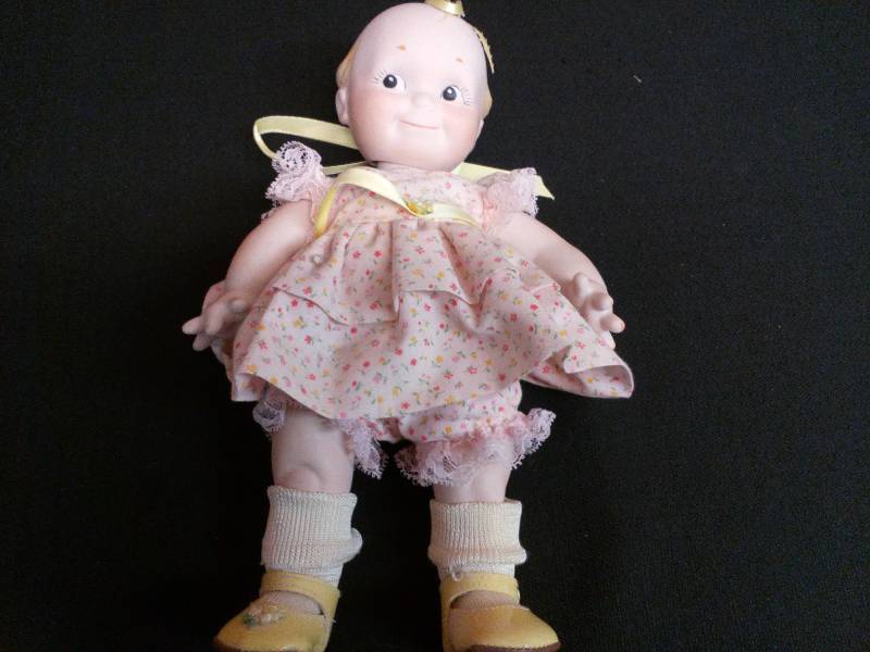 lot 92 image: Ruth Freeman Porcelain Kewpie Doll DatedSigned 1987