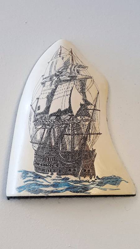 lot 1064 image: Scrimshaw Replica Carved Ship Art Whale ToothBone Colored w Felt-Back