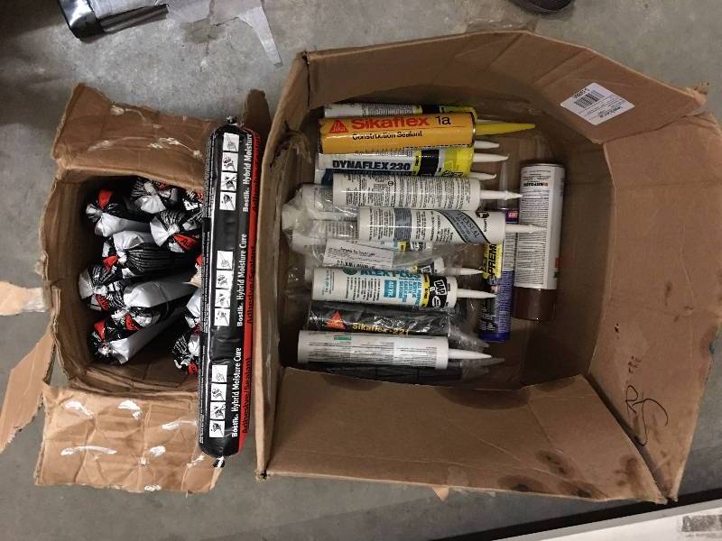 lot 123 image: CALKING AND ADHESIVE LOT