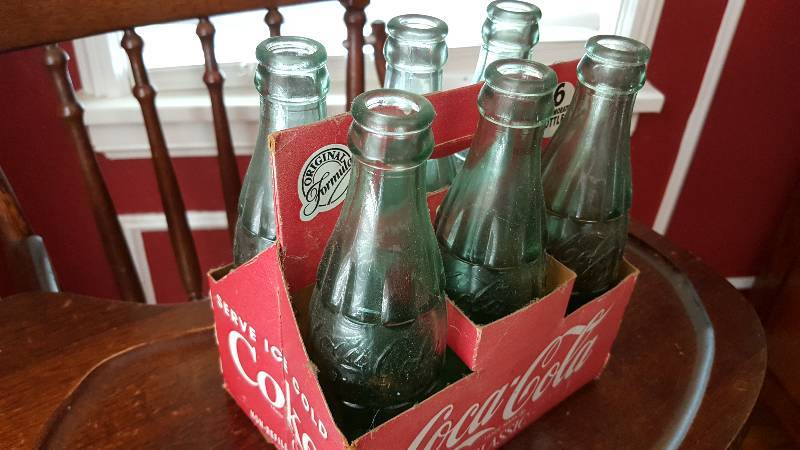 lot 6602 image: 6 pack of real glass and original formula CocaCola bottles in the carrier