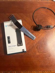 lot 1018 image: Fitbit charge 3 with charging and additional band