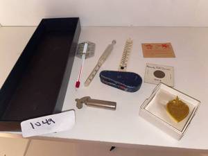 lot 1049 image: Thermometer, pitch pipe, coin penny