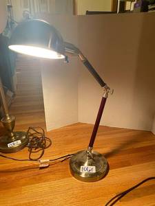 lot 1061 image: Adjustable metal burgundy lamp- about 3 feet tall