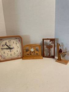 lot 1082 image: Wall clock and decorative wood pieces