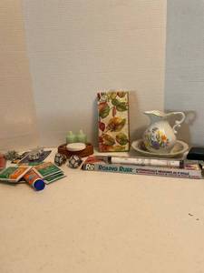 lot 1089 image: Decorative small pitcher with bowl, napkins, chain, packets of Off, a rolling ruler and more