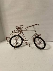 lot 1110 image: Bicycle made out of wire with rubber tires