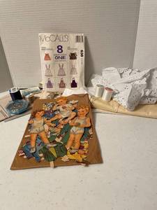 lot 1121 image: Apron pattern with supplies and vintage paper doll set with clothes