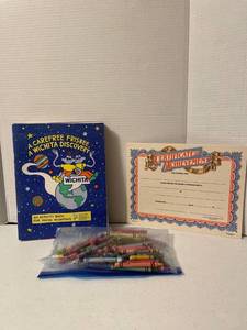 lot 1127 image: Nine Wichita discovery activity books, certificates of achievement, and crayons