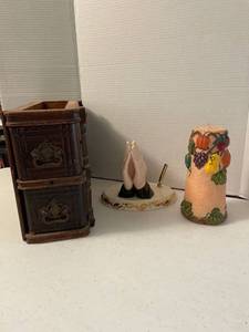 lot 1135 image: Antique sewing machine drawers with sewing supplies, praying hands pen holder, and candle