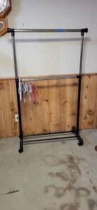 lot 2014 image: Portable clothes rack on wheels73x37.5 plus hangers