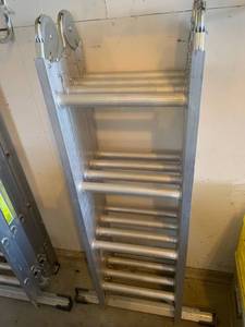 lot 3606 image: Werner ladder. 16ft tall. Straight ladder standing level. 12ft 4in. Step ladder 5ft 6in. Scaffolding 4ft 4in (like new)