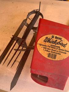 lot 5004 image: Grass seed spreader, an animal trap
