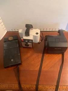 lot 1505 image: Vintage cameras. Polaroids and an autofocus