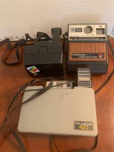 lot 1507 image: Vintage cameras. Polaroid instant cameras. 100. 420. The other is an Educator Addition