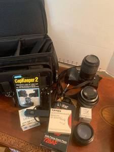 lot 1513 image: Minolta camera with extra parts and lens and bag