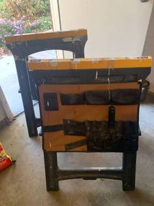 lot 3501 image: 2 Plastic saw horses. 1 has bag on side for tools