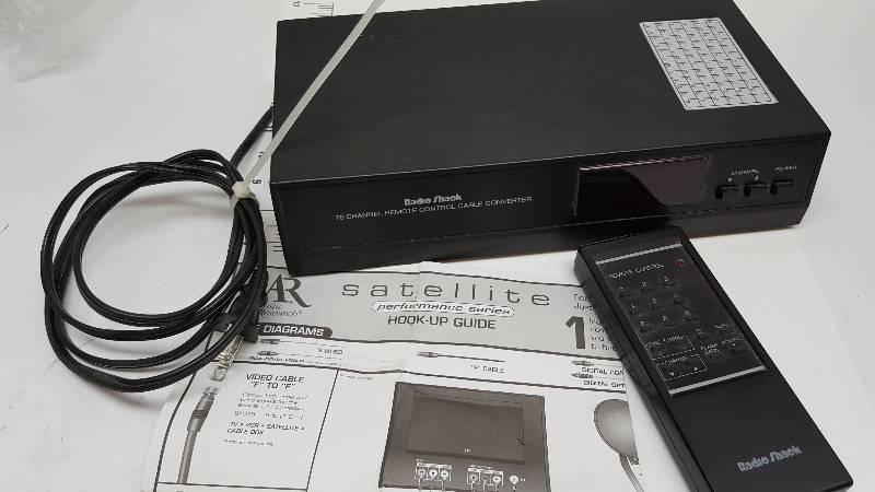 lot 6699 image: Dont know if anybody can use this Radio Shack Satellite box and remote but were going to find out.