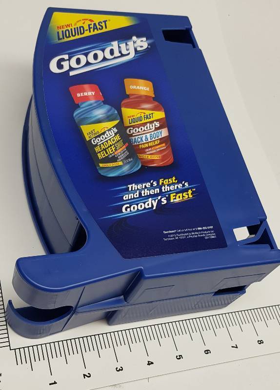 lot 6742 image: Cool heavy plastic roll dispenser with a Goodys Headache sticker on the side.