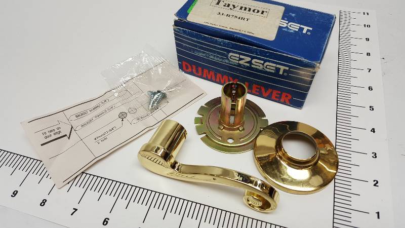 lot 6748 image: New in the box is this EZSET polished brass Dummy Door Lever