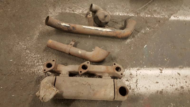 lot 6572 image: Complete 85 horse Ford Flathead V8 exhaust manifold heater including the cable to open and close the flapper valve from the 30s or 40s