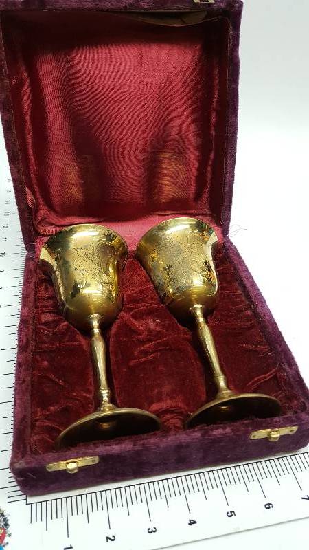 lot 6595 image: Brass pair of brass wine toasting cups in the collectable case