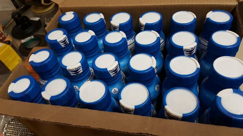 lot 6554 image: Full case 24 8OZ bottles) of the Ensure Enlive Vanilla Doctor Recommended for Therapeutic Nutrition.  Expired date on the bottles.