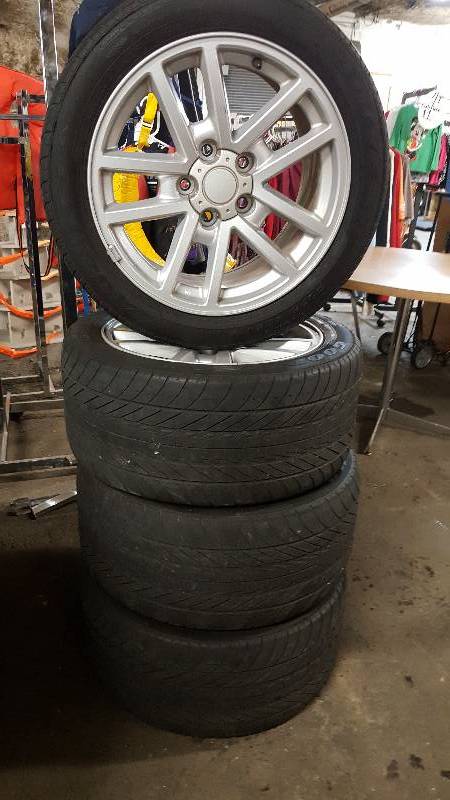 lot 6558 image: Full set of 90s Camaro Goodyear directional tires and the OEM alloy wheels.