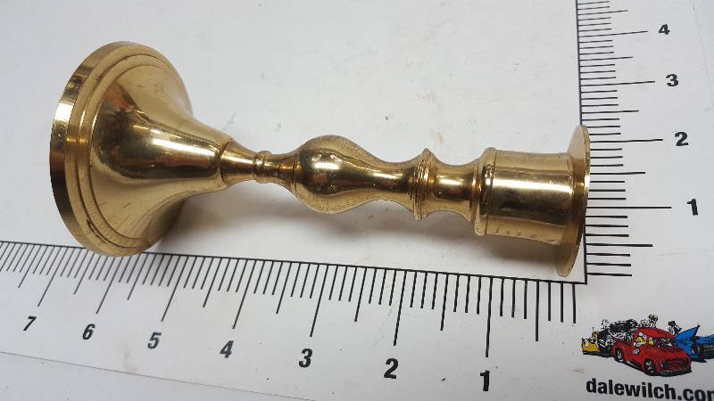 lot 6534 image: Brass and sharp looking candle holder