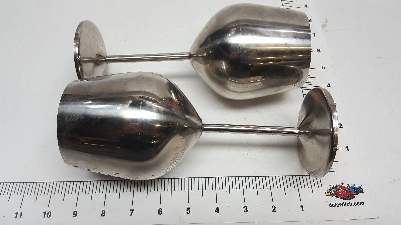 lot 6536 image: Pair stainless steel wine goblets.  Looking good on your counter top or kitchen cabinets