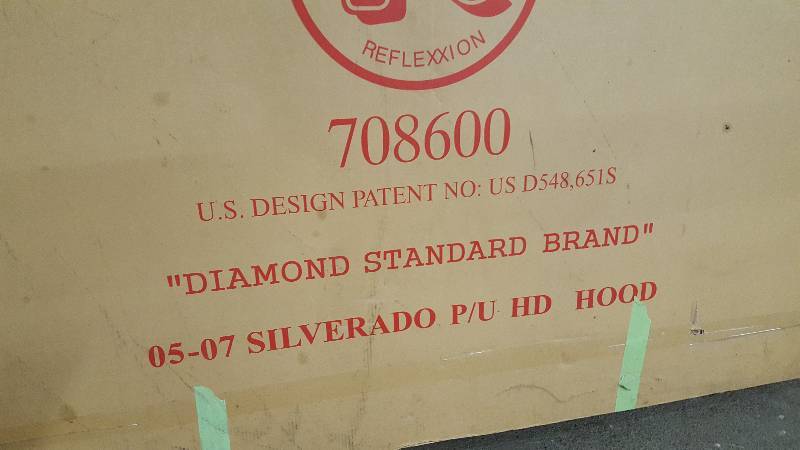 lot 6462 image: This is the stock hood that came off the truck that got the Reflexxion Cowl hood.  If youre got a wrinkle in your 05-07 Silverado pick up hood