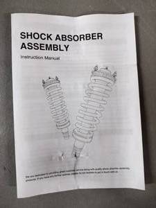 lot 1650 image: 27L Black Strut Shock Assembly