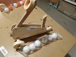 Hand crafted catapult w/ 6 balls.